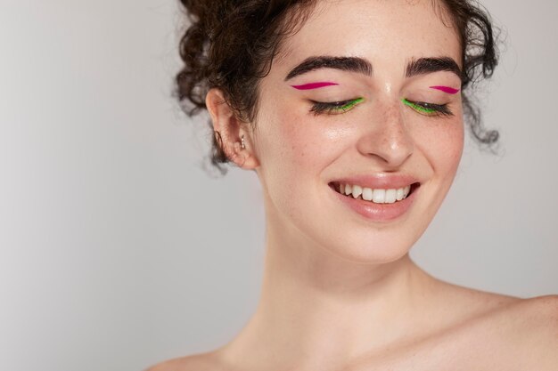 Beautiful caucasian woman with colorful eyeliner