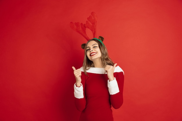 Free photo beautiful caucasian woman with long hair like santa's reindeer