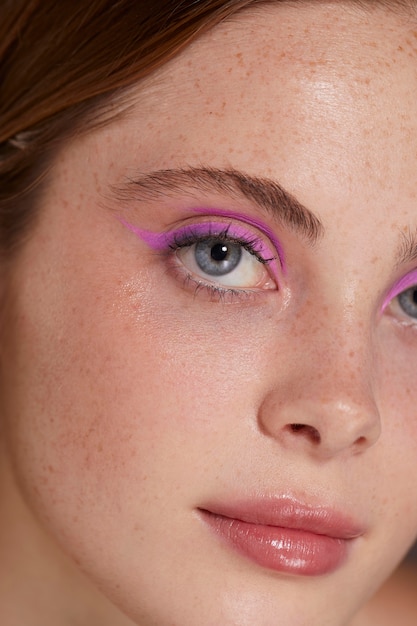 Beautiful caucasian woman with pink eyeliner