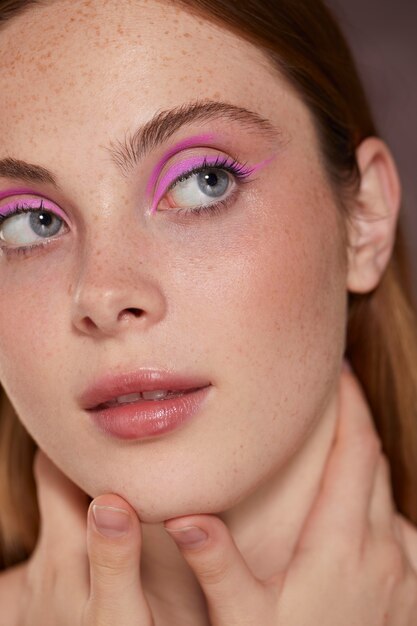 Beautiful caucasian woman with pink eyeliner