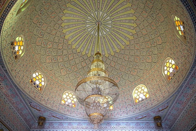 Free photo beautiful ceiling in islamic, muslim style with large chandelier and vintage windows