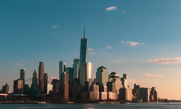 Beautiful cityscape with tall skyscrapers near the sea in New York City, USA