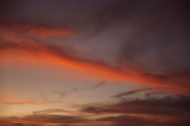 Beautiful clouded night sky with red shades