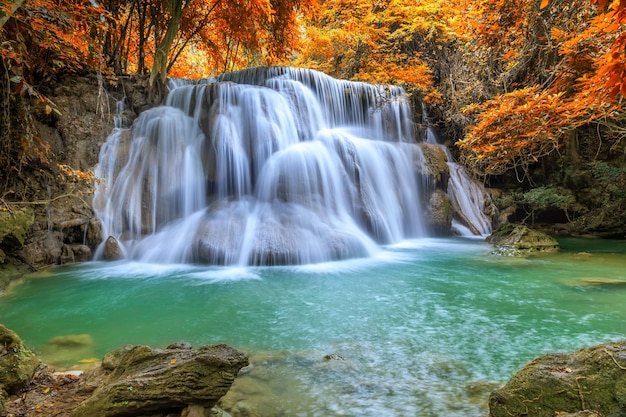 Free Photo beautiful and colorful waterfall in deep forest during idyllic autumn