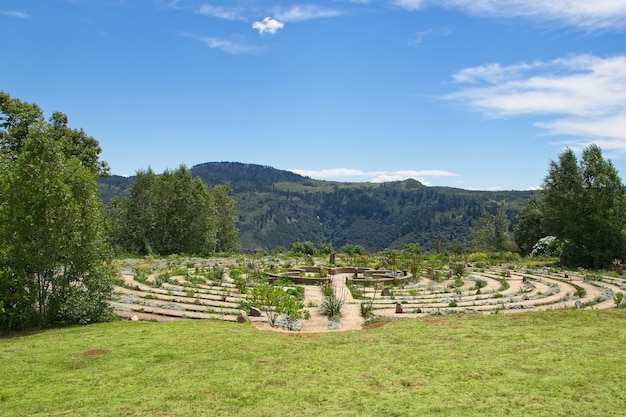 Beautiful concrete maze surrounded by grass covered fields and trees