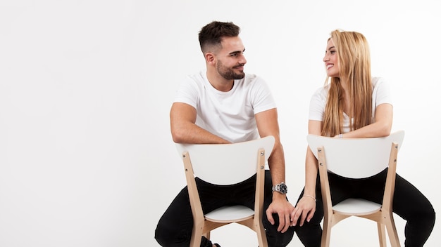 Beautiful couple on chairs 