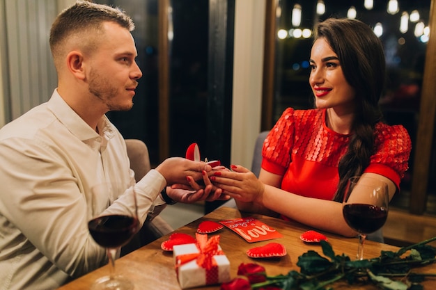 Free Photo beautiful couple engaging at dinner