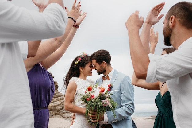 Free Photo beautiful couple having their wedding on the beach