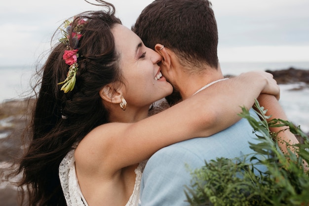 Beautiful couple having their wedding on the beach