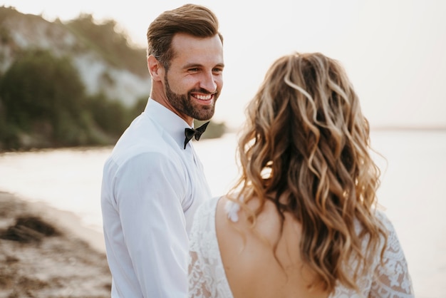 Free photo beautiful couple having their wedding at the beach