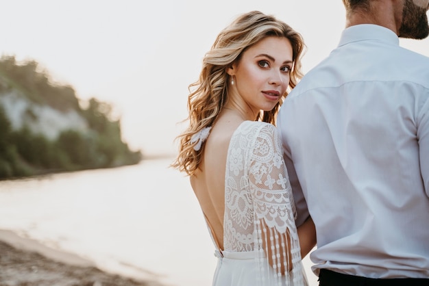 Free photo beautiful couple having their wedding at the beach