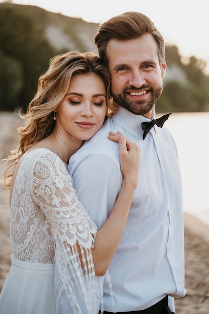 Beautiful couple having their wedding at the beach