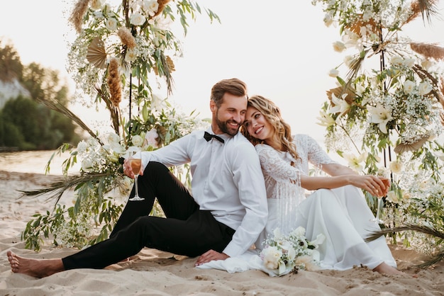 Free Photo beautiful couple having their wedding at the beach