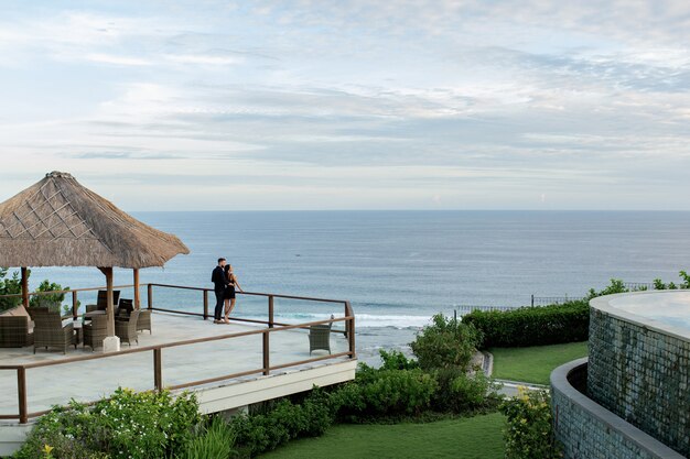 Beautiful couple look at the ocean