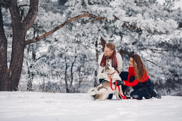 Beautiful couple playing with a dog