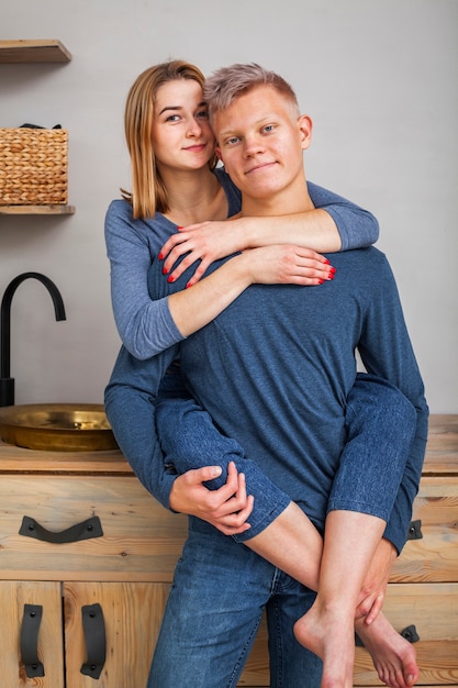 Beautiful couple posing in the kitchen