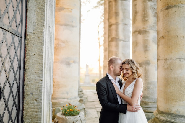 Free photo beautiful couple posing on their wedding day