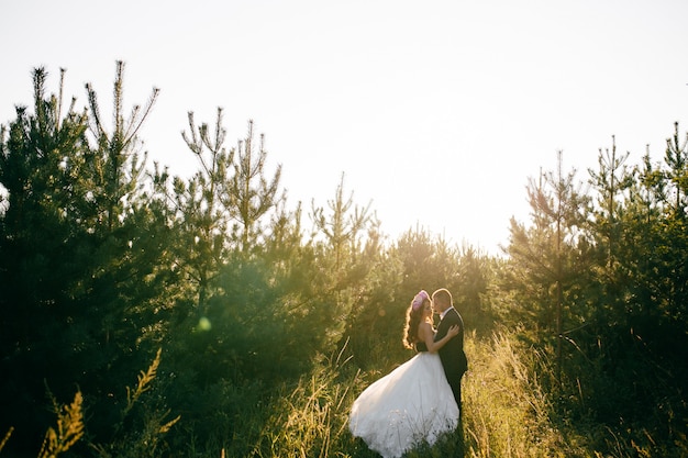 Free Photo beautiful couple posing on their wedding day