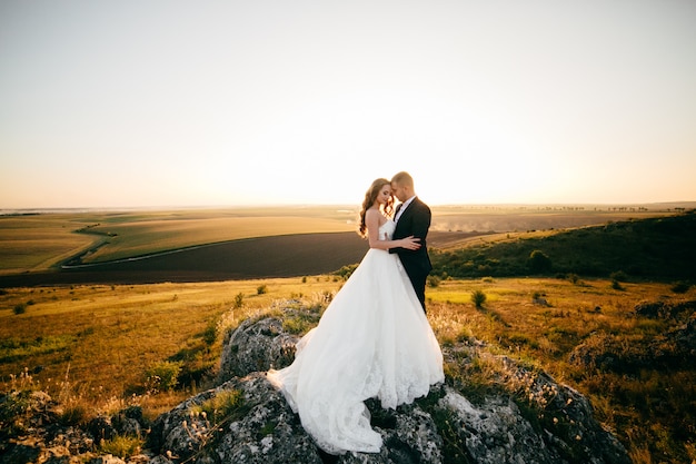 Beautiful couple posing on their wedding day