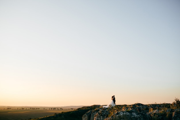 Free Photo beautiful couple posing on their wedding day