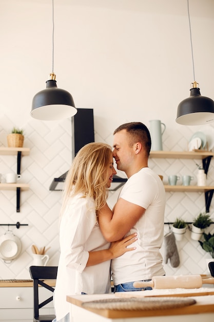 Free Photo beautiful couple prepare food in a kitchen