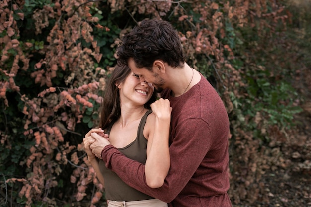 Beautiful couple showing love to each other outdoors