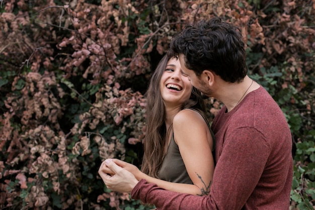 Beautiful couple showing love to each other outdoors