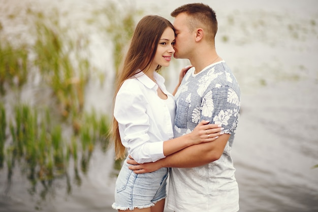 Beautiful couple spend time in a autumn cloudy park