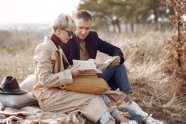 Free photo beautiful couple spend time on a autumn field