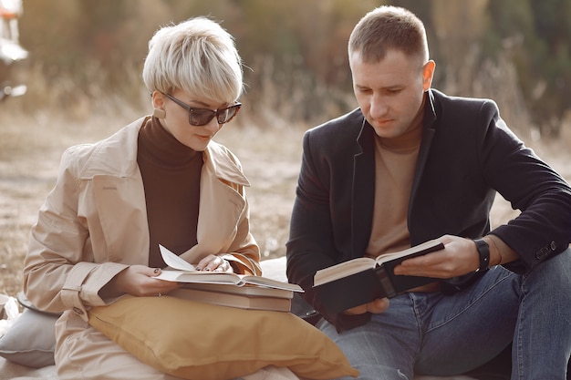 Free photo beautiful couple spend time on a autumn field