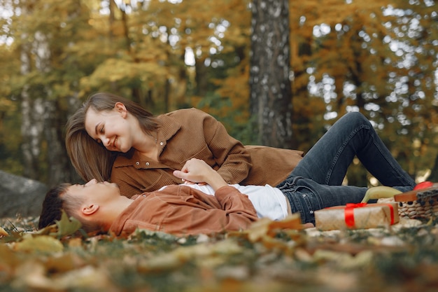 Free photo beautiful couple spend time in a autumn park