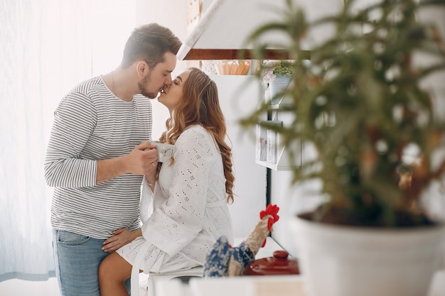 Free photo beautiful couple spend time in a kitchen