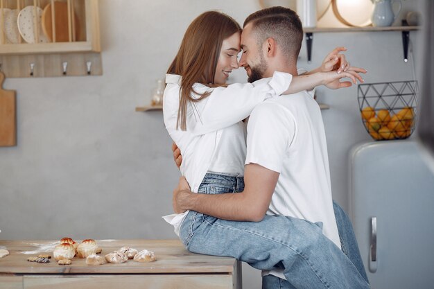 Beautiful couple spend time in a kitchen