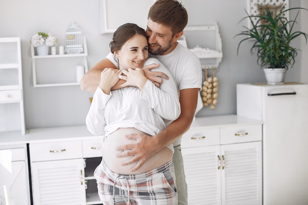 Beautiful couple spend time in a kitchen