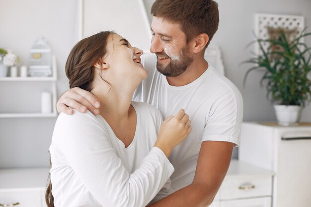 Beautiful couple spend time in a kitchen