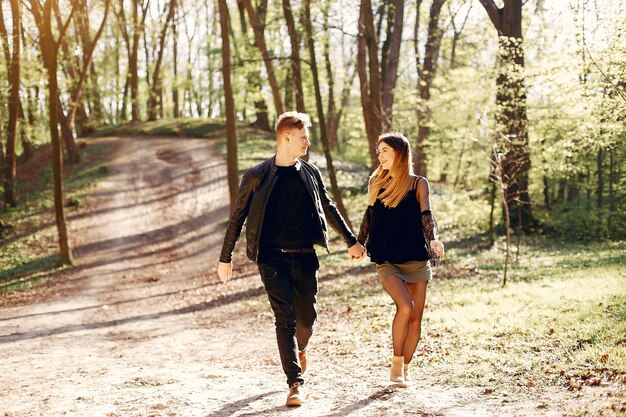 Beautiful couple spend time in a spring park