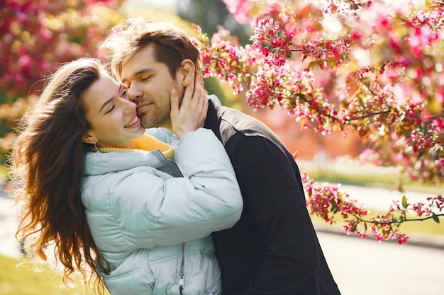 Beautiful couple spend time in a spring park