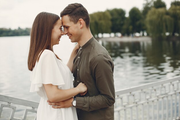 Beautiful couple spend time in a summer city