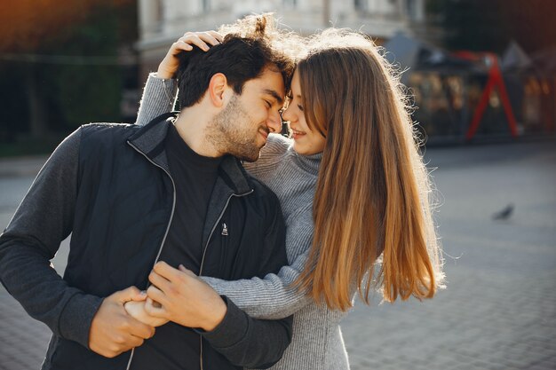 Beautiful couple spend time in a summer city