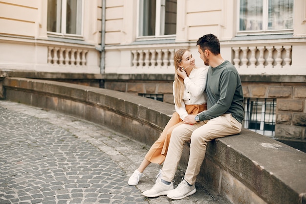 Beautiful couple spend time in a summer city