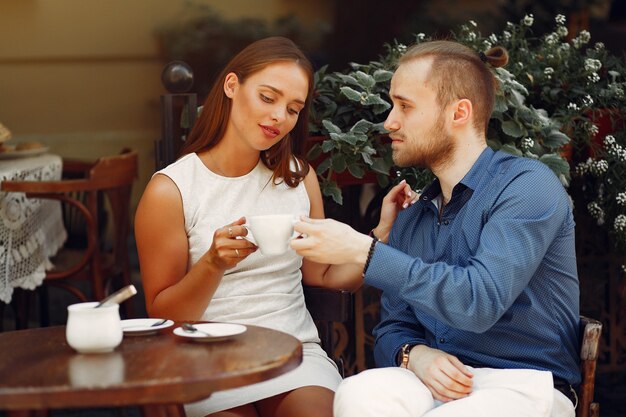 Beautiful couple spend time in a summer city