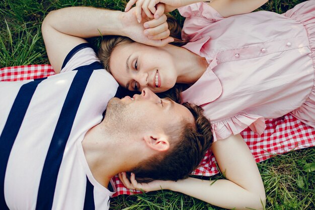 Beautiful couple spend time on a summer field