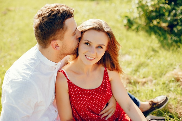 Beautiful couple spend time on a summer field