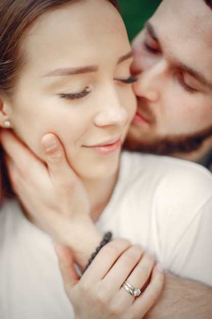 Free photo beautiful couple spend time on a summer forest