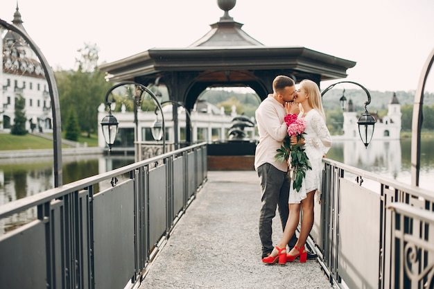 Free Photo beautiful couple spend time in a summer garden