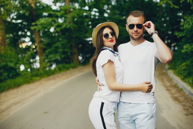 Beautiful couple spend time in a summer park