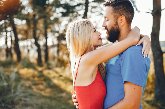 Beautiful couple spend time in a summer park