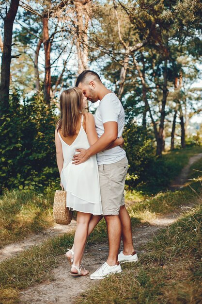 Beautiful couple spend time in a summer park