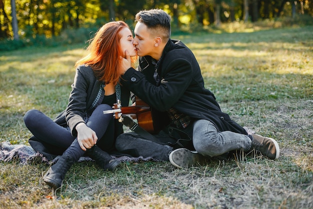 Beautiful couple spend time in a summer park