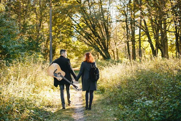 Free photo beautiful couple spend time in a summer park